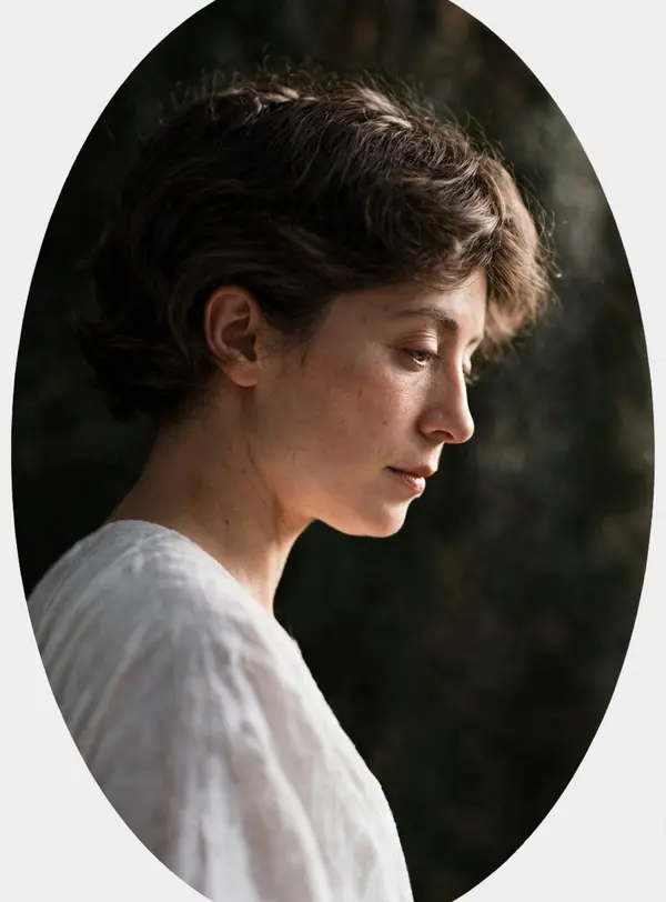 A young woman in profile in an oval frame, 1914, restored in real-life color