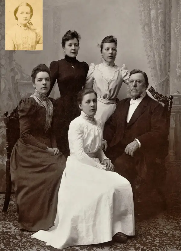 A family of five in a Victorian studio portrait, restored