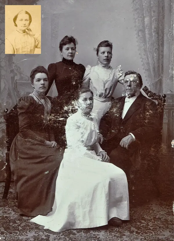 A family of five in a Victorian studio portrait, the damaged original
